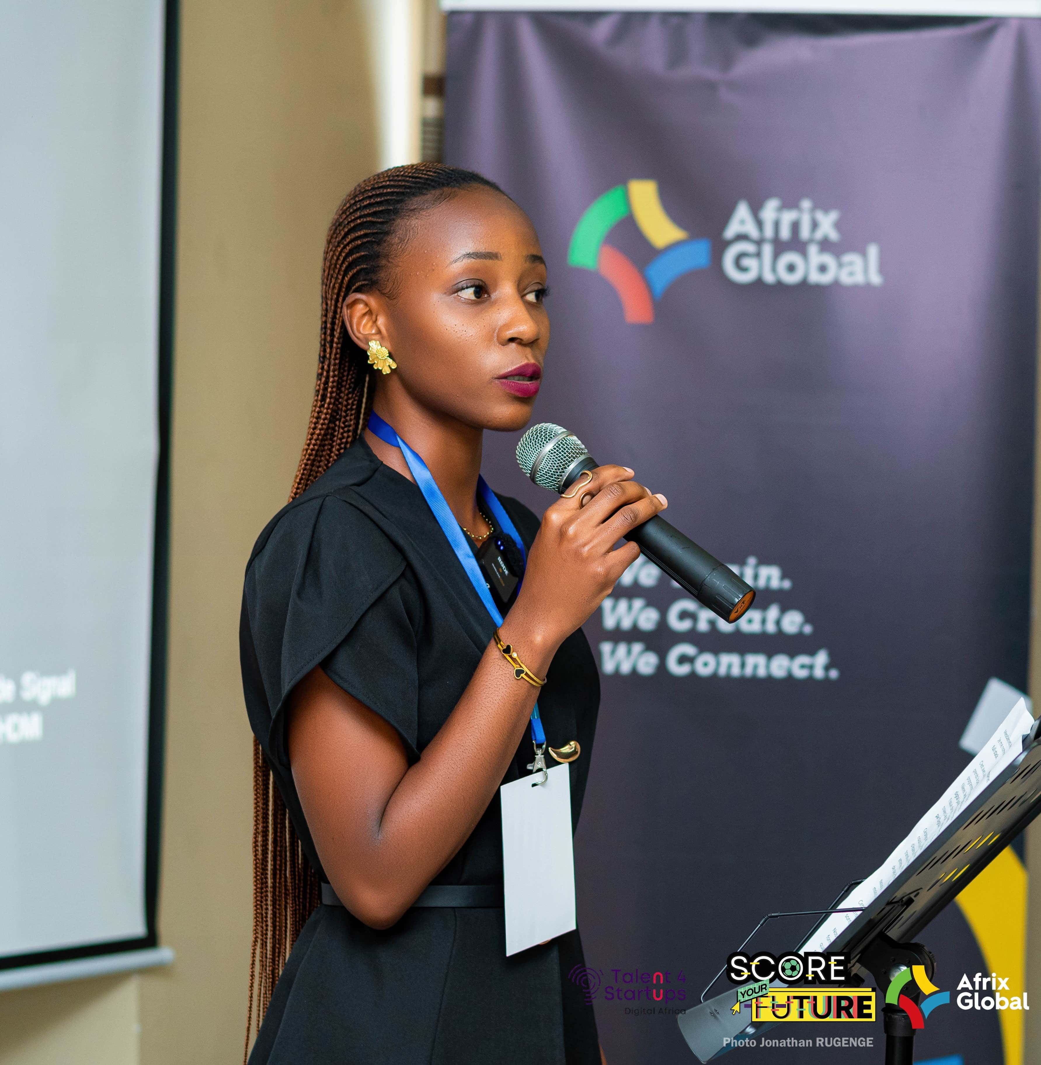 African startup founder presenting to a team in an innovation hub